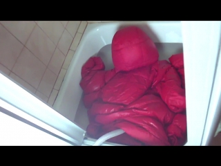 wet down jacket fjaellr ven orange inflated in the shower room 1